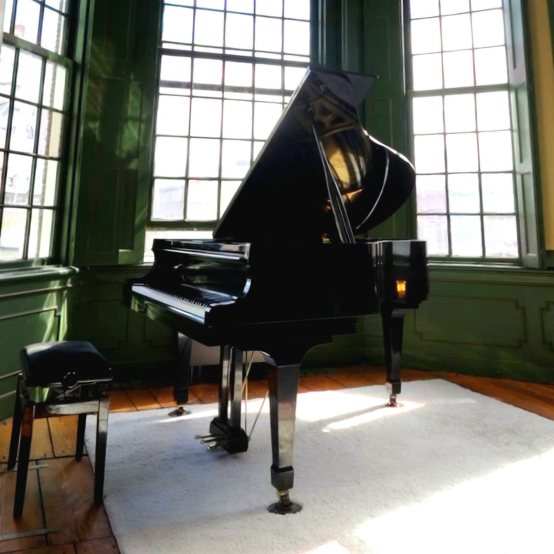 The grand piano in the sunlit recording room