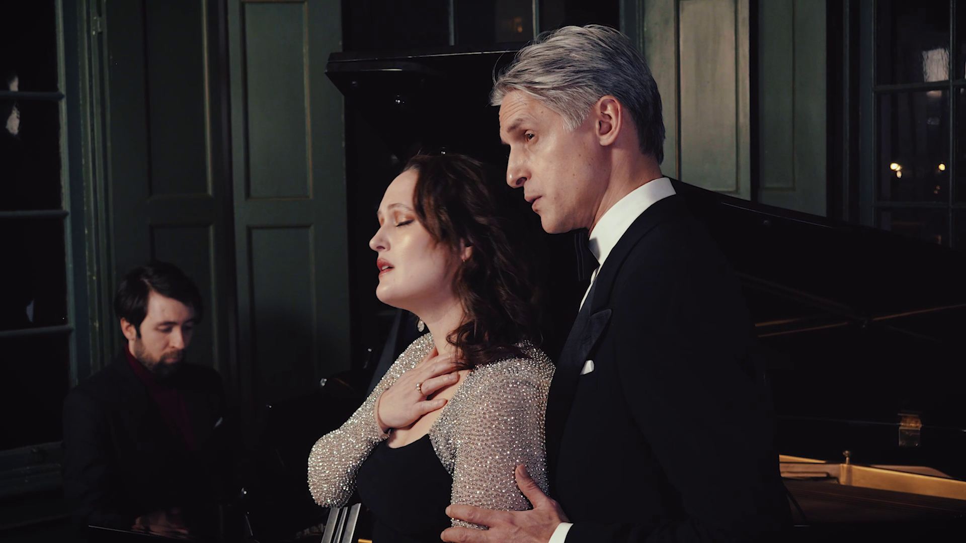 Duo in formal attire performing an intimate duet